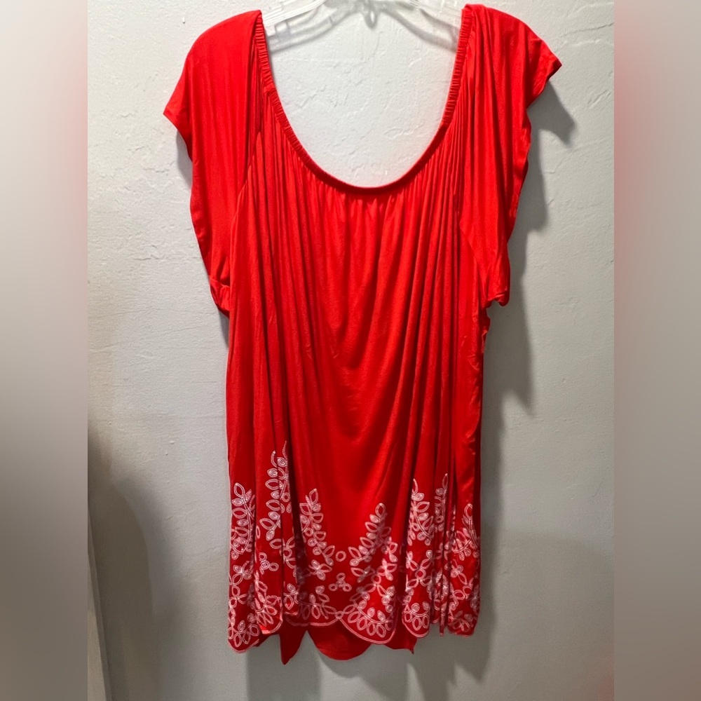 Size 34/36 NWT Orange with white embroidered flowers , can wear off shoulder